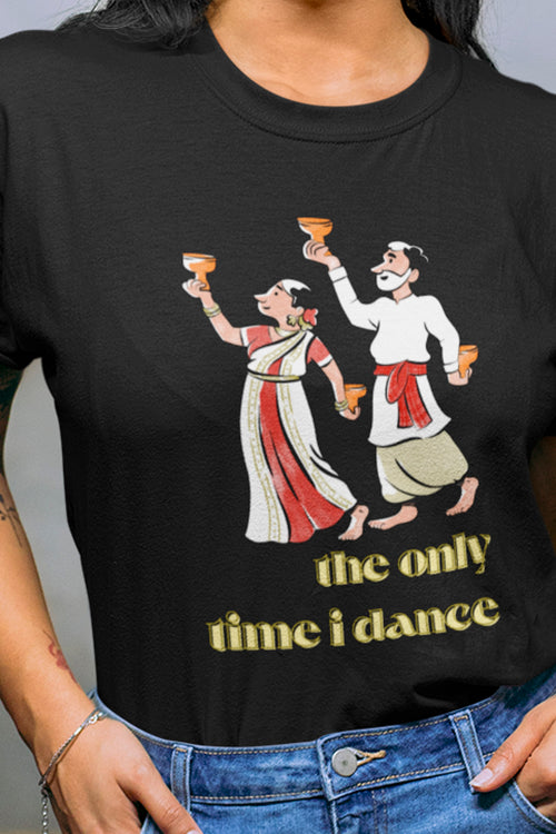 Black t-shirt with a graphic of two people dancing and text 'the only time i dance' worn by a person.