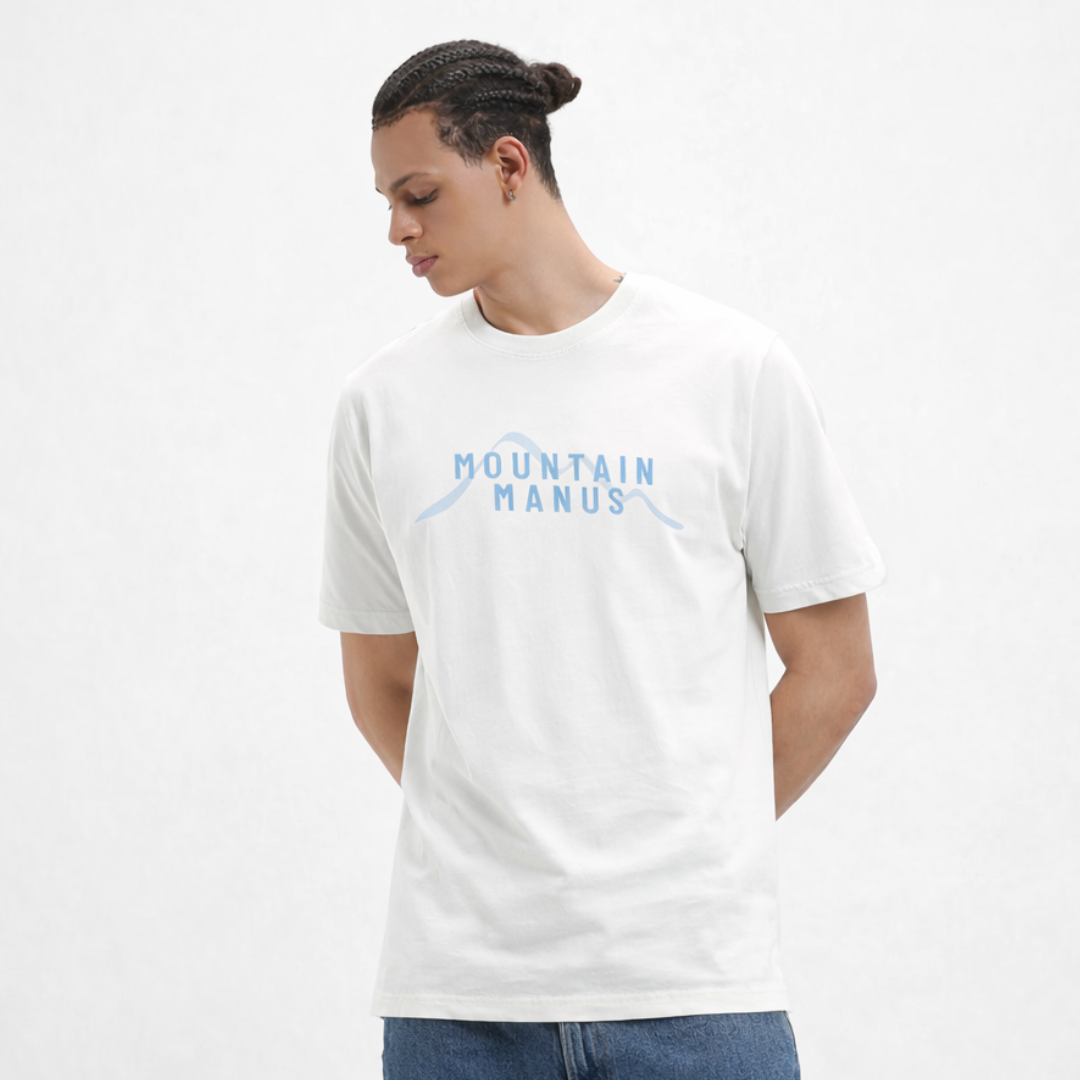 Person wearing a white t-shirt with 'Mountain Manus' logo on a plain background