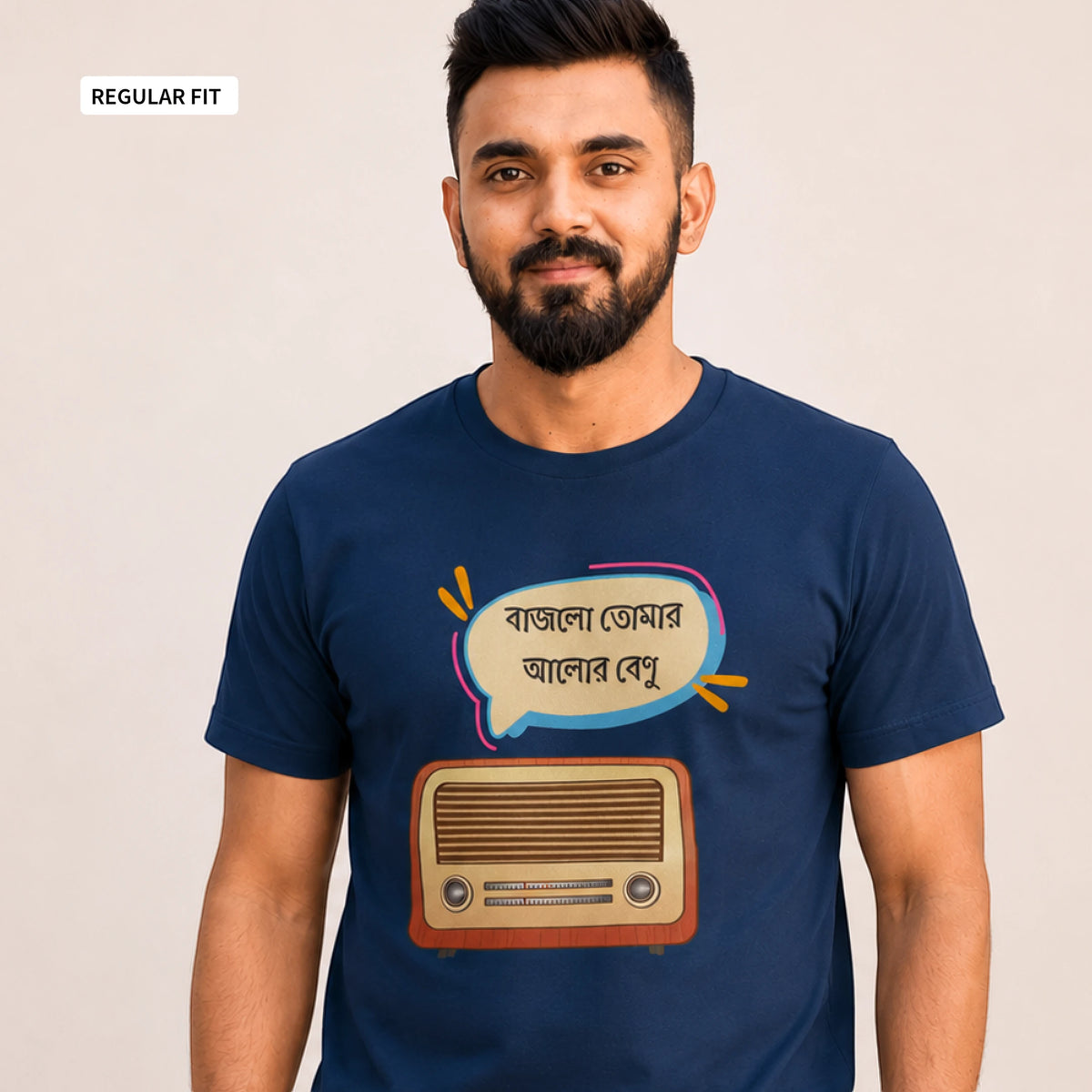 A man wearing a navy blue graphic t-shirt with a cartoon retro radio and Bengali text bubble. The image has a 'REGULAR FIT' label in the top-left corner.