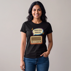 A woman wearing a black graphic t-shirt with a cartoon radio and Bengali text print, paired with blue jeans, standing against a plain light gray background.
