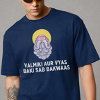 Person wearing a navy blue t-shirt with a graphic design and text on a gray background