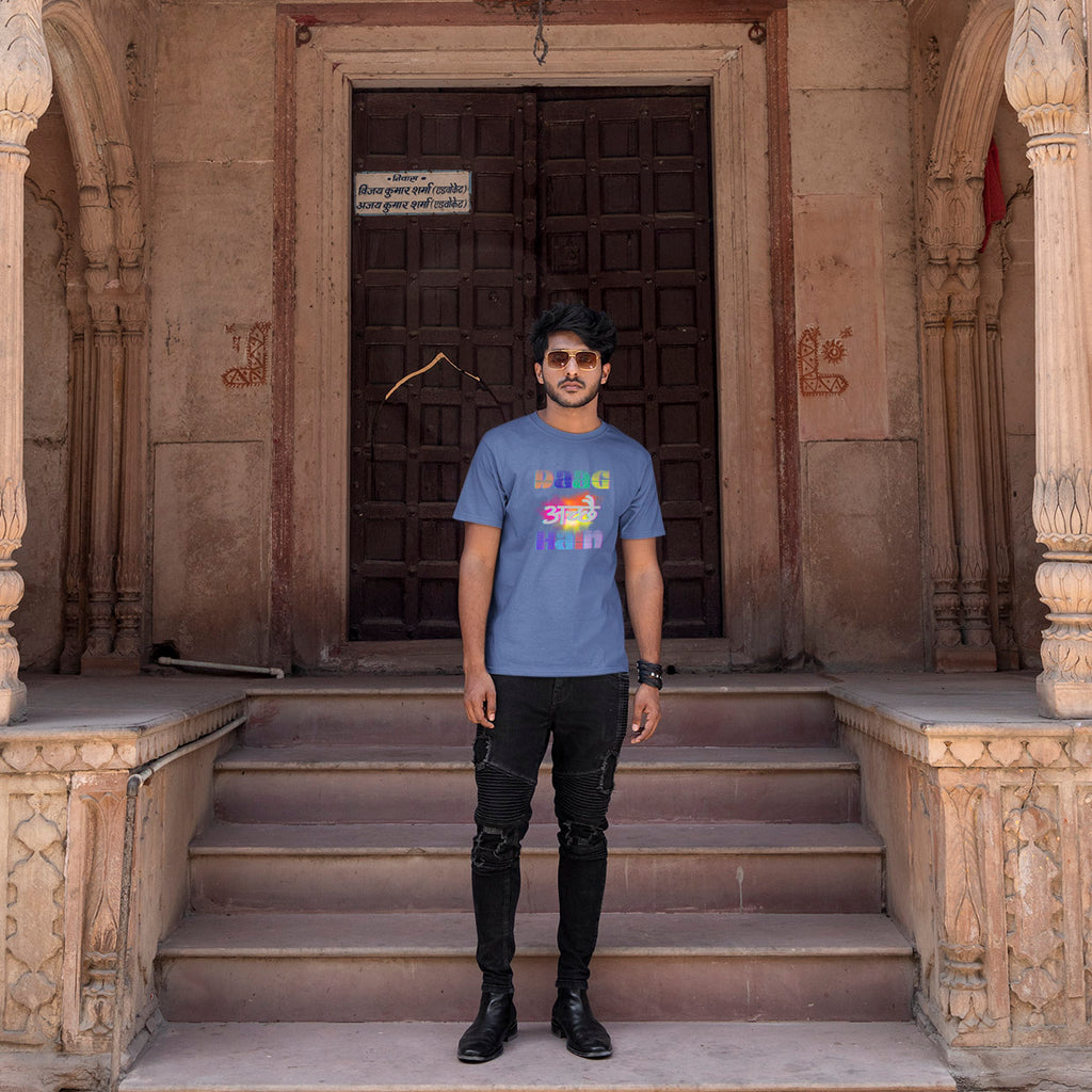 Man standing on steps in front of an ornate building entrance