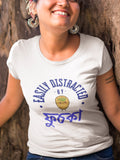 Person wearing a white t-shirt with blue text and graphics, standing against a natural background.